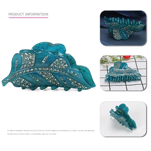 Pince à cheveux feuille bleue paon en acrylique avec strass blancs étincelants