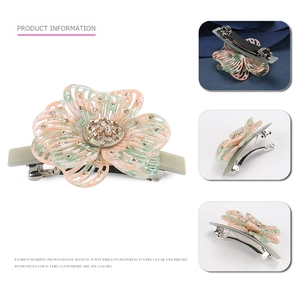 Floral resin spring hair clip with pink marble pattern and central sparkling rhinestones