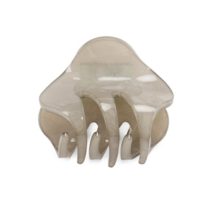 Detail view of the elegant grey-brown acrylic hair claw with a subtle herringbone pattern
