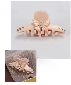 Detail view of pink acetate butterfly hair claw clip with rhinestones and size measurements