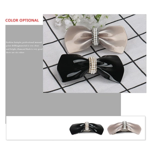 Retro bow hair clip with sparkling rhinestones and white pearls in black and taupe colors