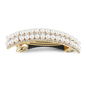 Detail view of large alloy spring hair clip with white pearls and sparkling rhinestones
