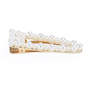 Detailed view of elegant gold-plated hair clip with white pearls and non-slip teeth