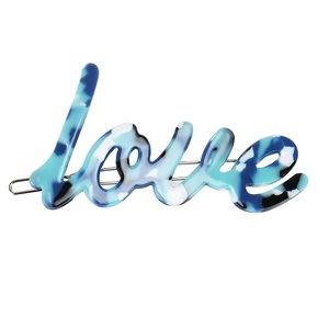 Detailed macro view of the marble blue acetic acid love hair clip with silver metal base