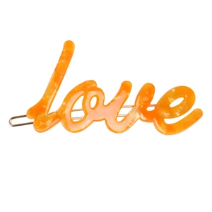 Detail of orange marble acetate hair clip with silver metal base and Love lettering