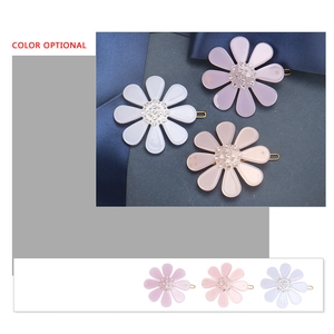 Elegant floral acetate hair clips with crystal inlay in white, lavender, and pink colors