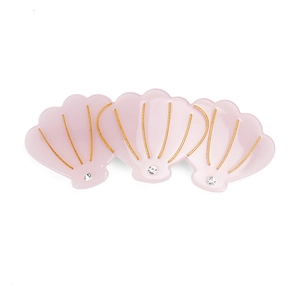 Barrette à cheveux trois coquillages rose pâle en acétate avec lignes d'or et cristaux