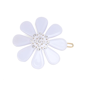 Pastel purple flower hair clip with rhinestones and golden metal clip on white background