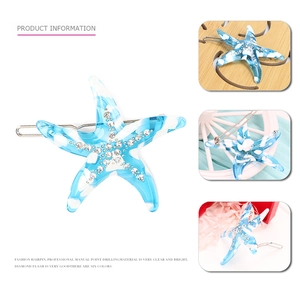 Detailed views of marbled blue starfish hair clip with sparkling rhinestone accents