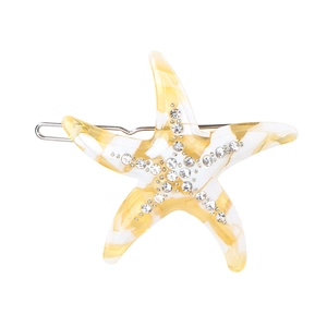 Detail of yellow and white starfish hair clip with sparkling rhinestones and metal clip