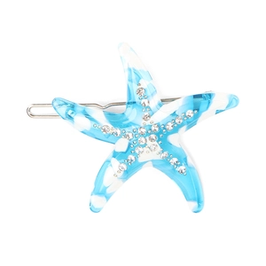 Detail of blue starfish hair clip featuring marble resin texture and sparkling rhinestones