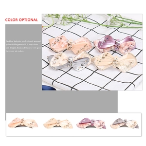 Bow-shaped acetate hair clip with sparkling rhinestones in six stylish color options