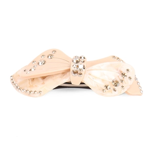 Elegant bow hair clip with acetate marbling and sparkling champagne rhinestones