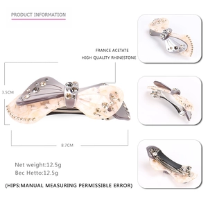 Acetate bow hair clip with rhinestones and marble pattern, size 8.7cm by 3.5cm