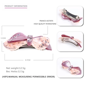 Pink marble acetate bow hair clip with sparkling rhinestones and silver metal spring base