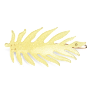 Detailed view of yellow acetate leaf hair clip with gold glitter and metal back clip