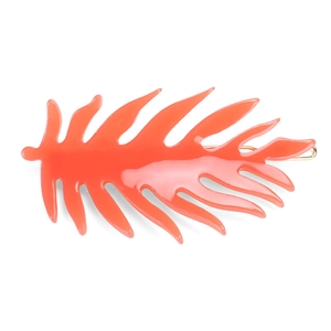 Vibrant orange acetate leaf-shaped hair clip with gold metal alligator grip for women