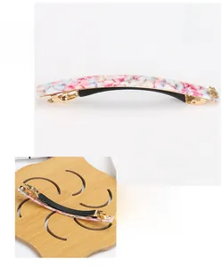 Detailed view of floral acetate spring hair clip showing dimensions and non-slip inner grip