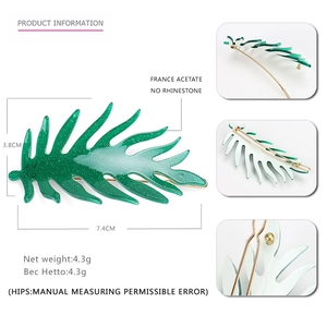Green leaf acetate hair clip with glitter finish and gold metal back, 7.4cm size