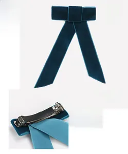 Detail view of large navy velvet bow hairpin showing dimensions 14.8x12.5cm and spring clip