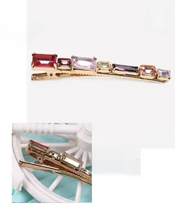 Detail view of colorful crystal hair clip with dimensions of 1.1x8.1cm and 11.1g weight