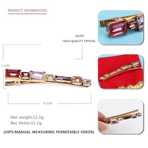 Detailed view of pink and purple crystal hair clip with dimensions 8.1cm x 1.1cm