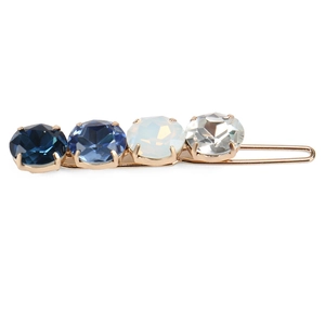 Detail view of gold-plated hair clip with gradient blue to clear crystal rhinestones