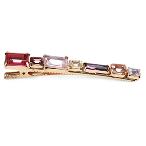 Detailed view of colorful rectangular crystals on a golden geometric hair clip