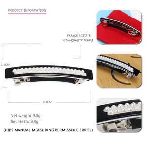 Detail view of black acetate spring clip with double row pearls and size measurements