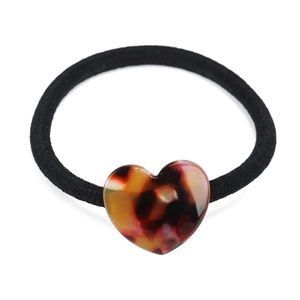 Elastico per capelli minimalista con un ciondolo a cuore in acetato con motivo leopardato