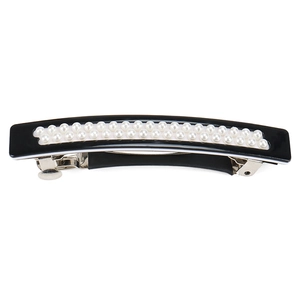 Close-up of black acetate hair clip featuring double rows of elegant white pearls