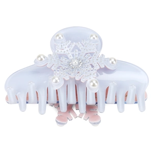 Detailed view of lavender acetic hair claw featuring snowflake design with pearls
