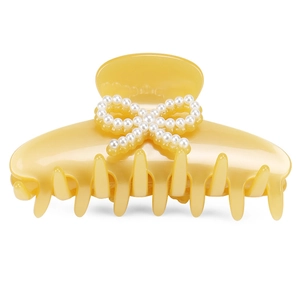 Elegant yellow acetate hair claw clip featuring a white pearl bow for women