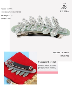 Detail of leaf-shaped France acetate hair clip with sparkling rhinestones and spring clip