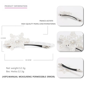 Elegant white snowflake hair clip with pearls and rhinestones in high-quality acetate