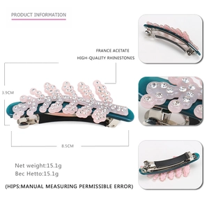 Deep green leaf hair clip with pink rhinestone decor and acetate finish 8.5cm