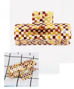 Detailed macro view of checkered acetate hair claw clip showing 4x7.8cm size and spring