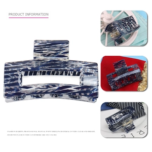 Detail of marble blue geometric hair claw clip showing various colors and textures