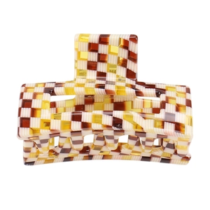 Detail view of medium acetate hair claw with vintage rectangular checkerboard pattern