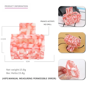 Pink and white marble acetate hair claw clip with minimalist geometric hollow design
