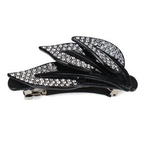 Elegant vintage leaf hair clip with crystals on a black spring barrette for women