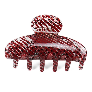 Grande pince à cheveux en acétate avec motifs géométriques rayés rouges, blancs et noirs