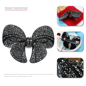 Macro detail of a large rhinestone bow hairpin with secure metal spring clip mechanism