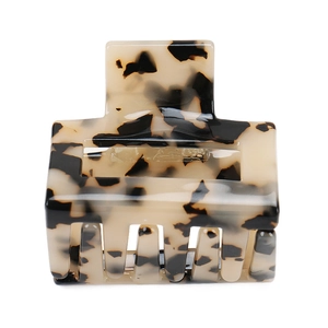 Detailed view of square acetate hair claw clip with tortoise shell leopard pattern