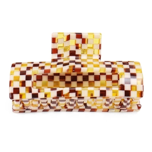 Detail of large rectangular acetate hair claw with vintage checkerboard pattern