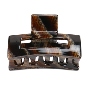 Detailed view of large dark brown amber tortoiseshell hair claw clip with strong spring