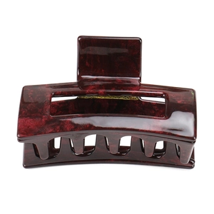 Detail of burgundy marble texture acetate rectangular hair claw clip with metal spring