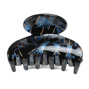 Medium acetate hair claw clip with dark blue gold marble pattern for women