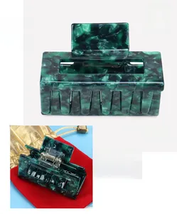 Detail view of large marble green acetate hair claw with exact size and weight dimensions