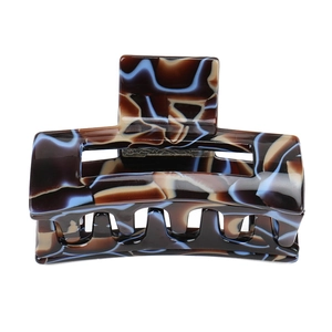 Detailed view of the marble patterned acetate geometric hollow hair claw clip